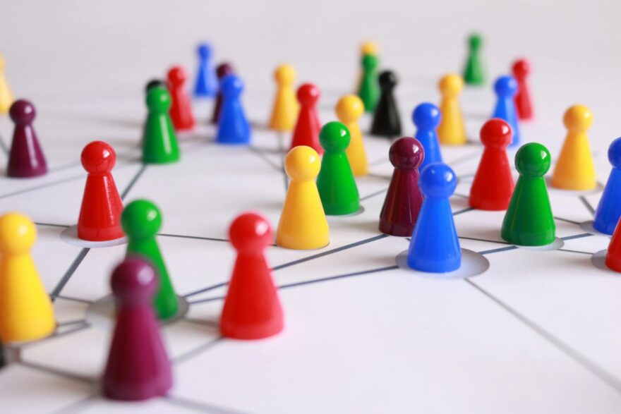 Chaos Theory: Understanding the Science Behind Unpredictable Systems close up photography of yellow green red and brown plastic cones on white lined surface